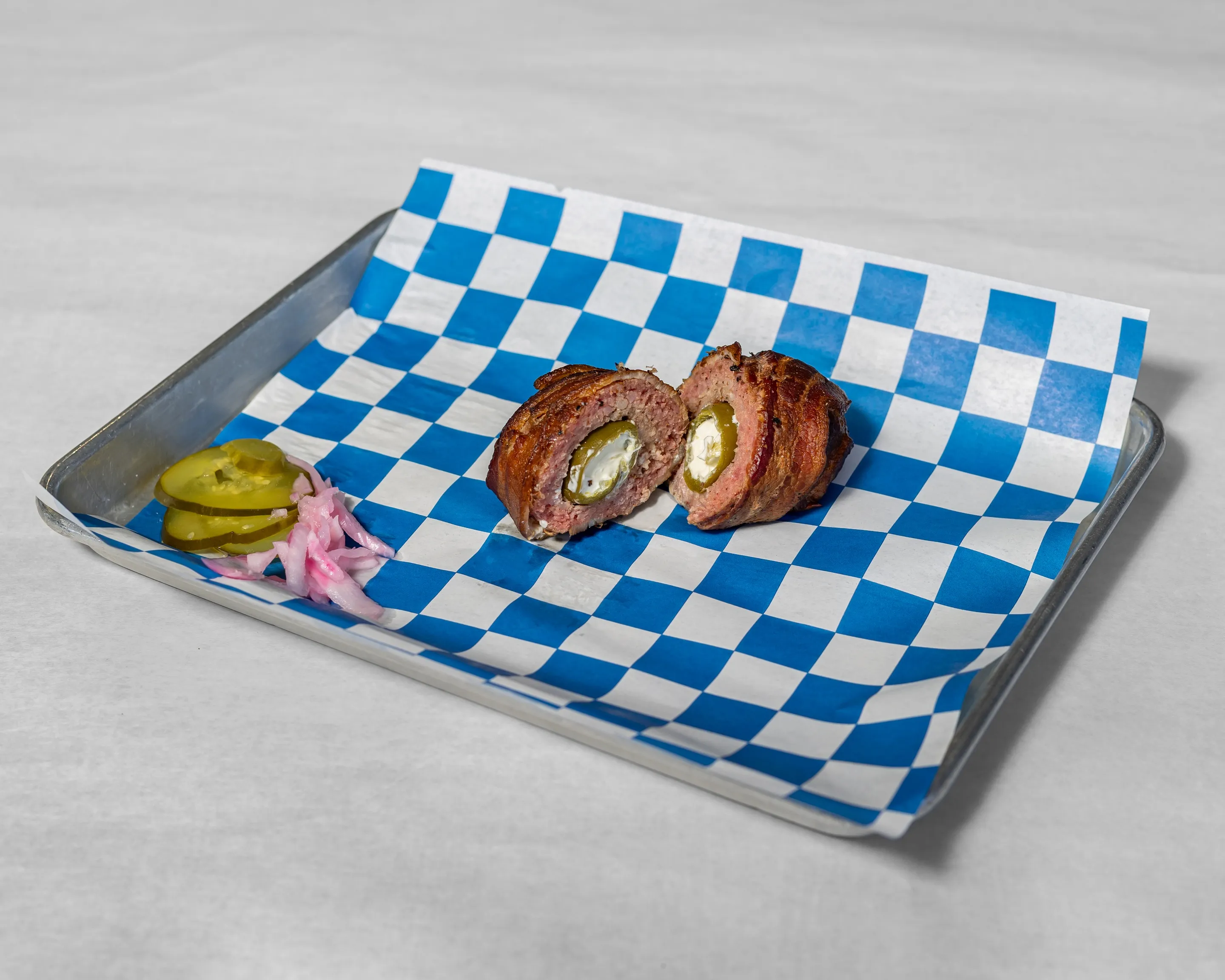 Armadillo Egg from Timmy Jon’s BBQ in Dade City, FL – jalapeño stuffed with cheese, wrapped in sausage and bacon, and smoked to perfection