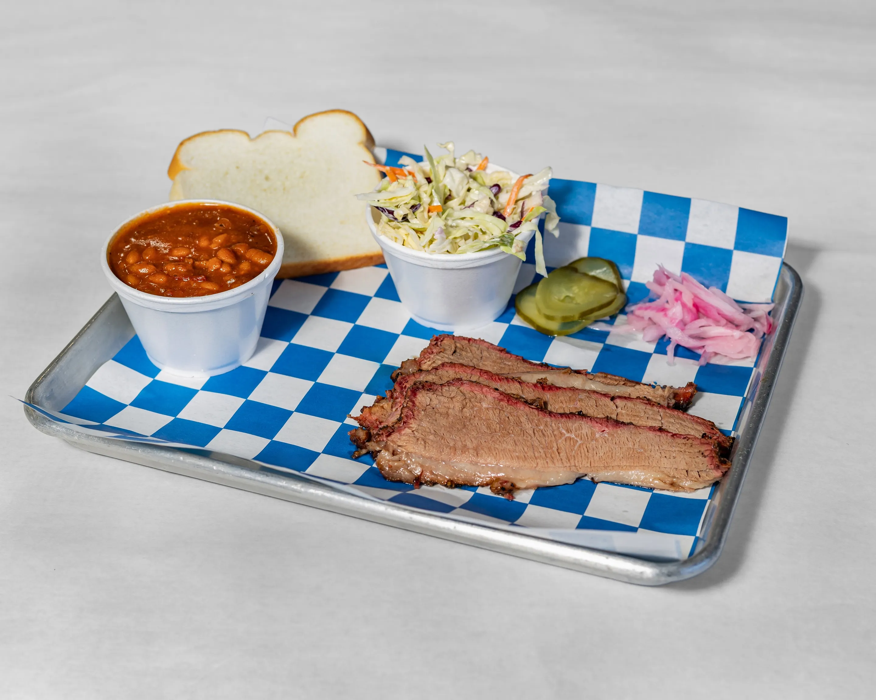 1 Meat Combo plate at Timmy Jon’s BBQ in Dade City, FL, featuring brisket, coleslaw and baked beans.